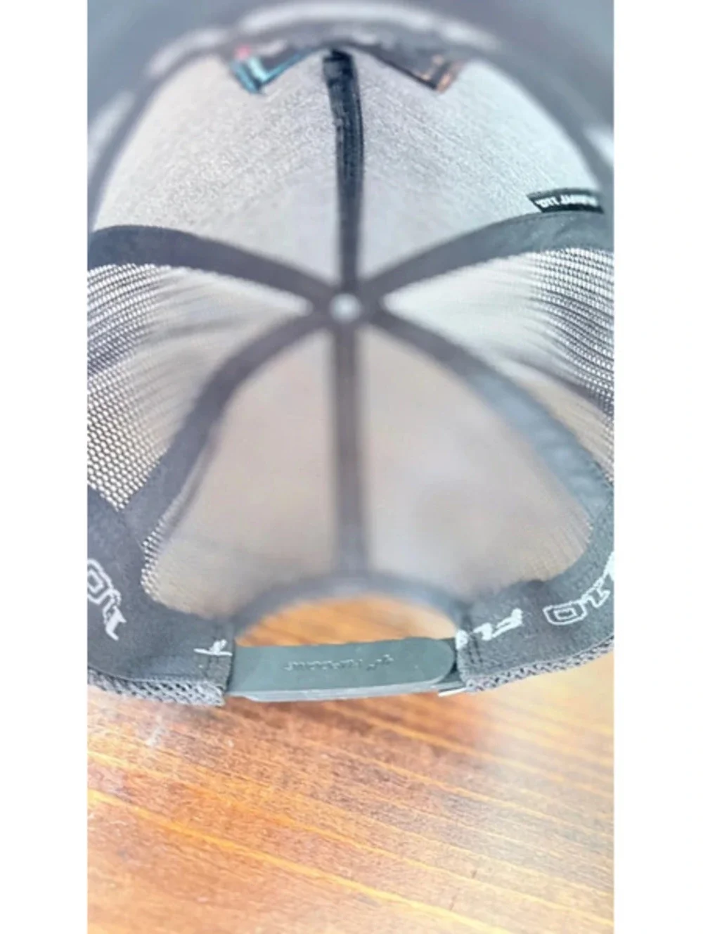 The north face trucker hat black with colorful logo